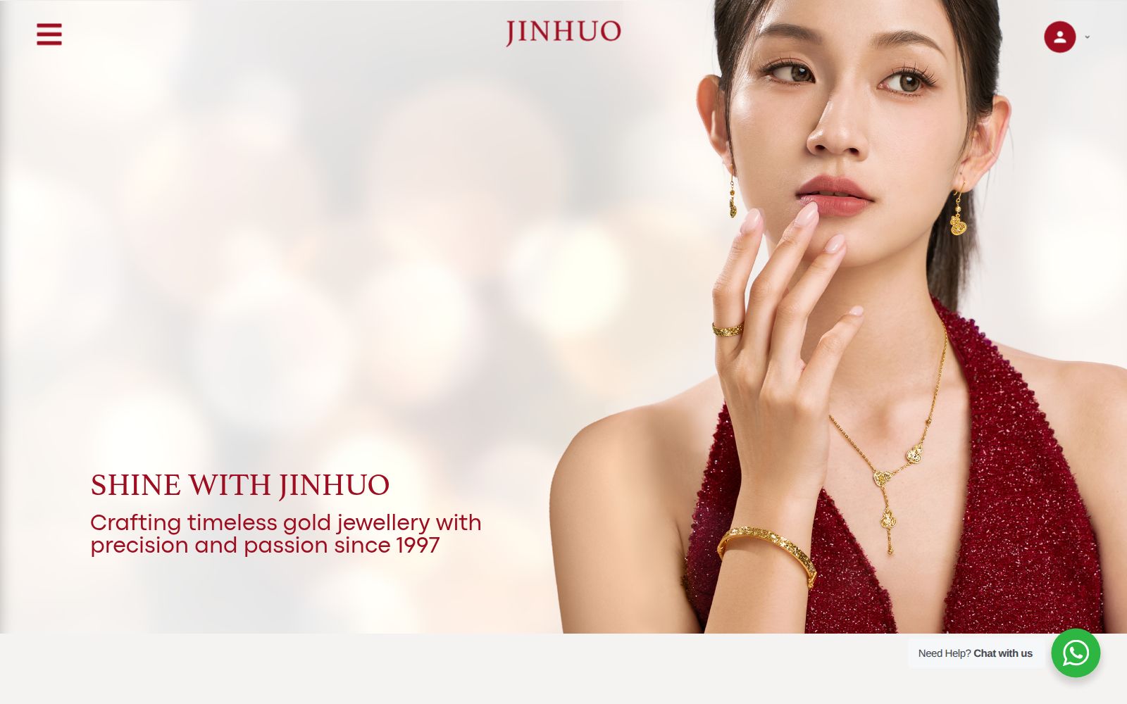 Home page of jinhuojewellery.com, a gold jewellery shop with a model wearing gold earrings, necklace and bracelet